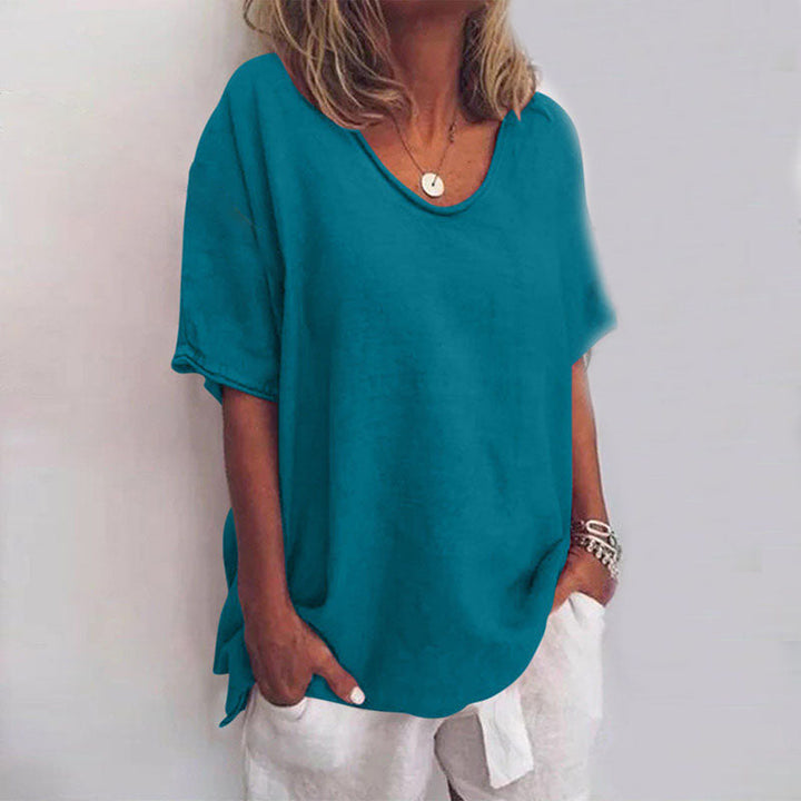 Stilvolle Damenbluse mit kurzen Ärmeln und lockerem Schnitt, ein vielseitiges Oberteil für Frauenmode.