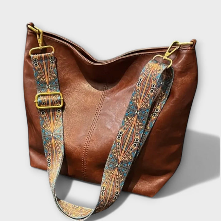 Elegante Damen-Schultertasche mit einzigartigem, farbenfrohem Riemen; ideales Mode-Accessoire.
