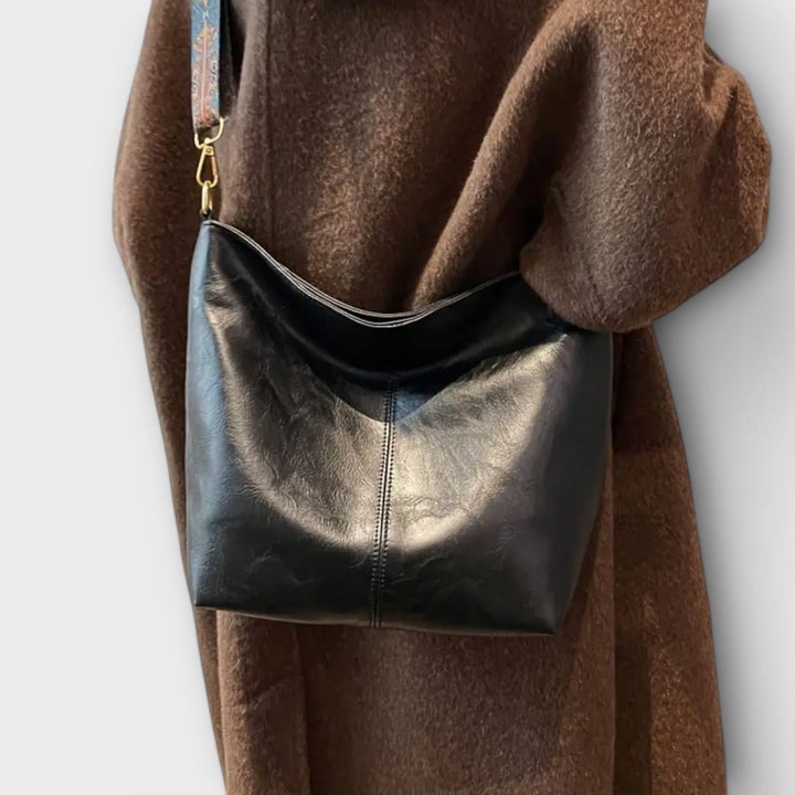 Praktische Damen-Schultertasche für den Alltag, mit einzigartigem Riemen; stilvolles Mode-Accessoire.