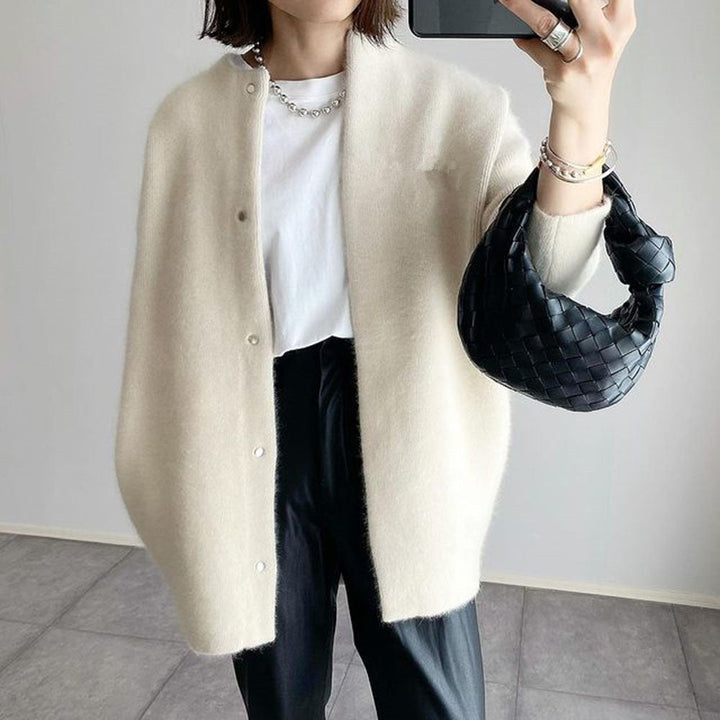 Vielseitige Damen Strickjacke Rundhals, uni, locker geschnitten. Eleganter Langarm-Cardigan für jede Gelegenheit.