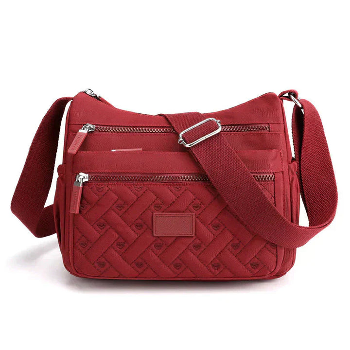 Wetterfeste Damen Alltagstasche mit praktischem Organizer, vielseitig als Crossbody Bag für jede Situation nutzbar.