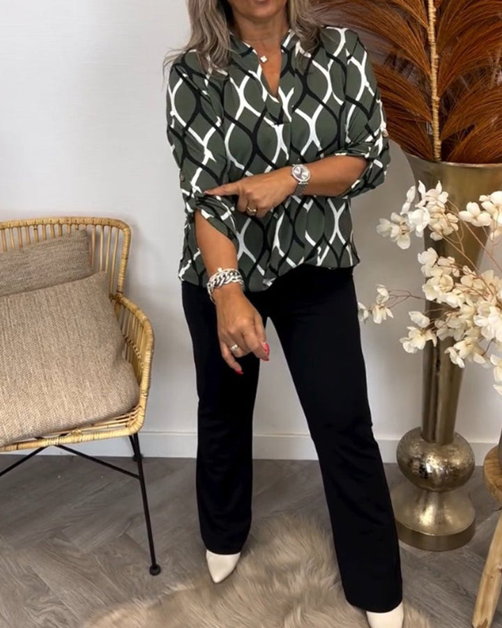 "Elegante Damenbluse mit geometrischem Muster, leichter Stoff, vielseitig für Anlässe, modernes Design, hoher Tragekomfort."