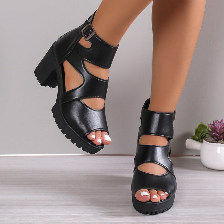 Elegante Damensandalen mit Peep-Toe-Design, hohem Blockabsatz und verstellbarem Knöchelriemen in Schwarz.