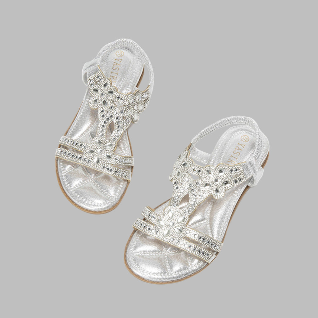 Emilia Damen Frühlingssandalen: flach, bequem und stilvoll mit Blumenapplikationen für sommerliche Eleganz.