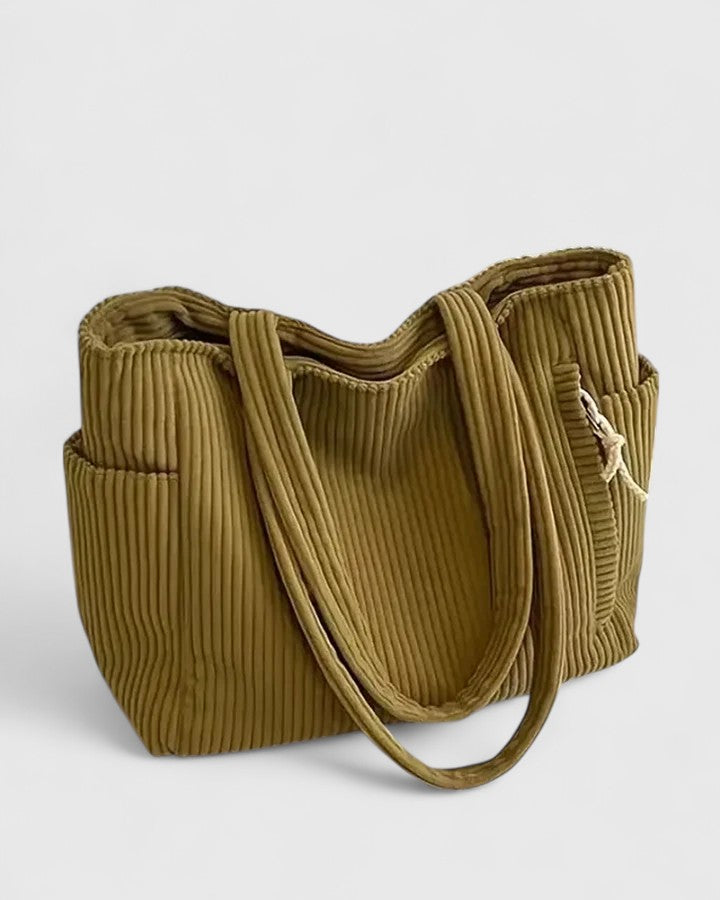 Modische, senfgelbe Damen-Schultertasche mit gerippter Struktur. Eine elegante Alltagstasche für moderne Frauen.