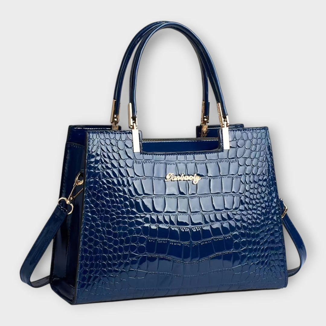 Zeitlose Damen Handtasche mit elegantem Verschluss. Klassisches Design in edler Lederoptik für stilvolle Auftritte.