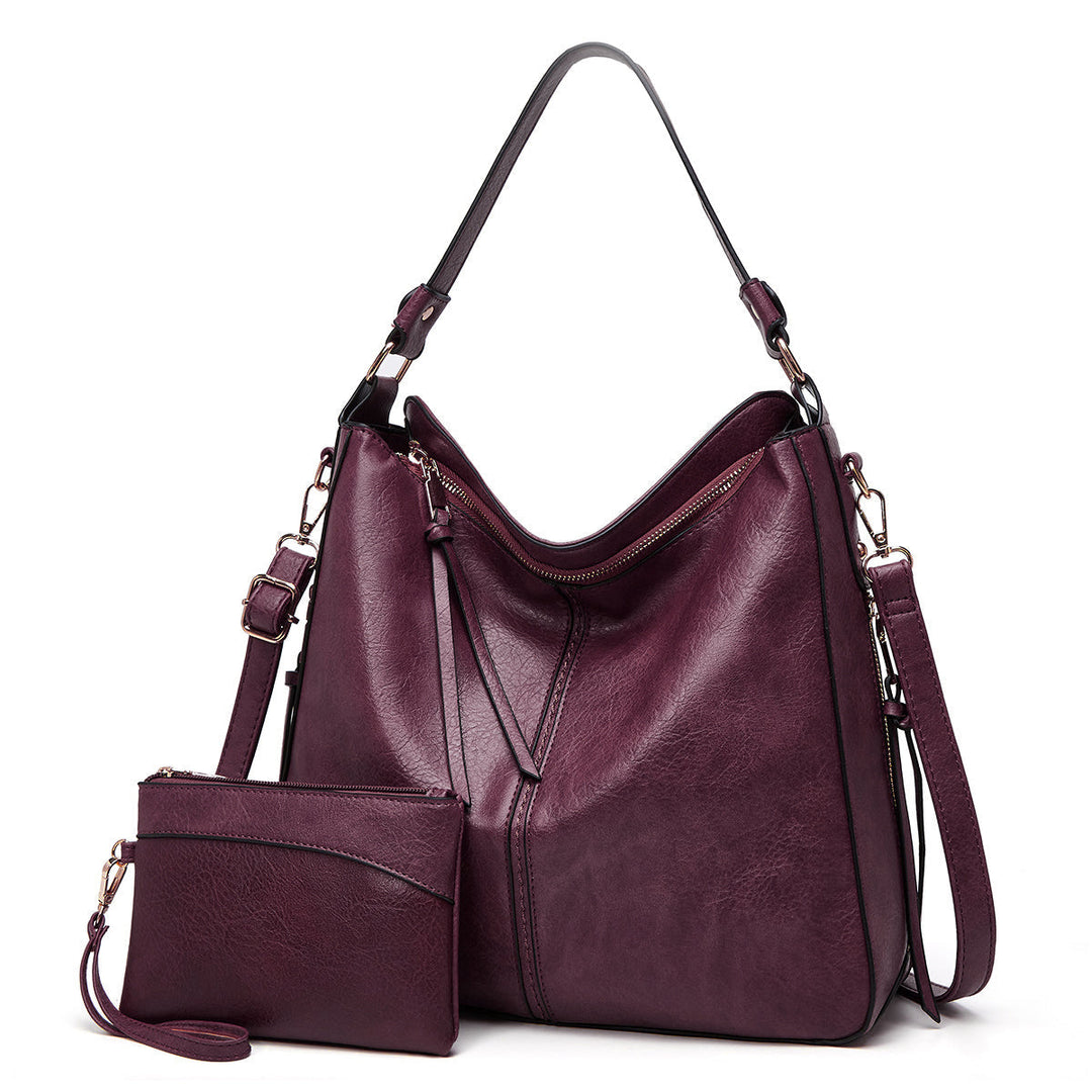 Damen Ledertasche am Arm getragen. Klassische Handtasche als stilvolles Fashion-Statement.