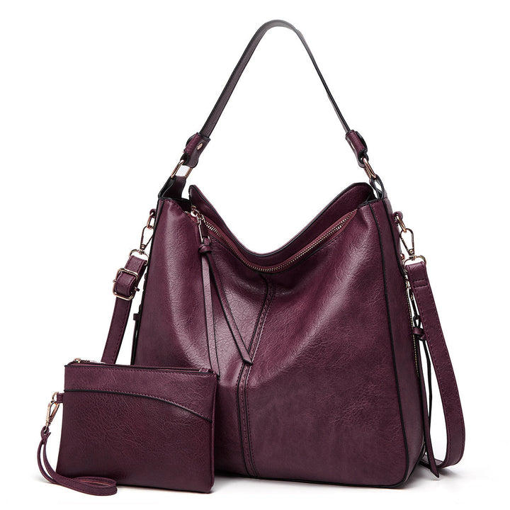 Damen Ledertasche am Arm getragen. Klassische Handtasche als stilvolles Fashion-Statement.