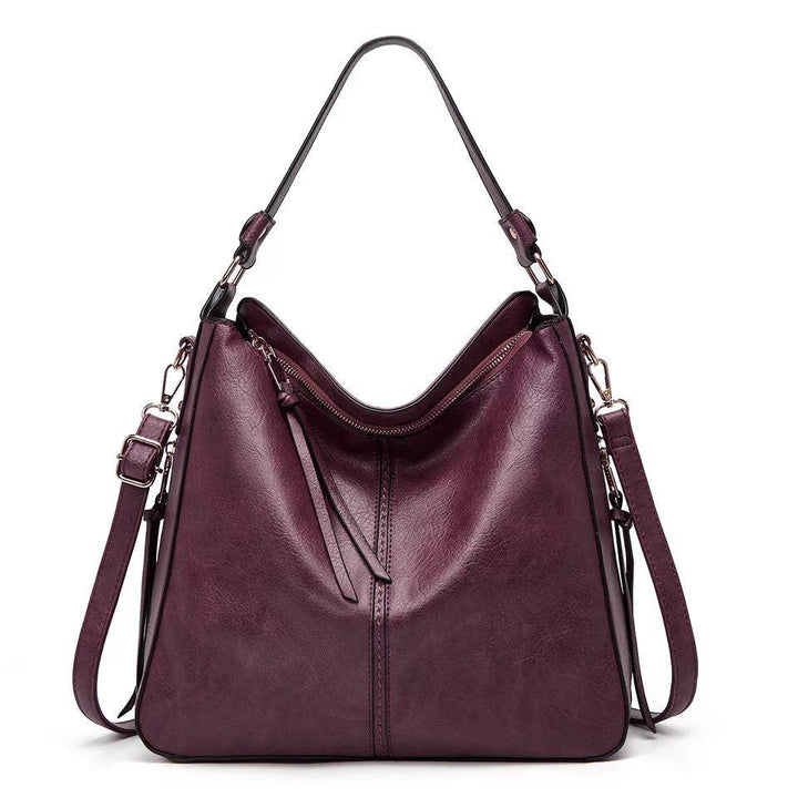 Stilvolle Umhängetasche aus Leder für Damen. Vielseitige Ledertasche mit verstellbarem Riemen.