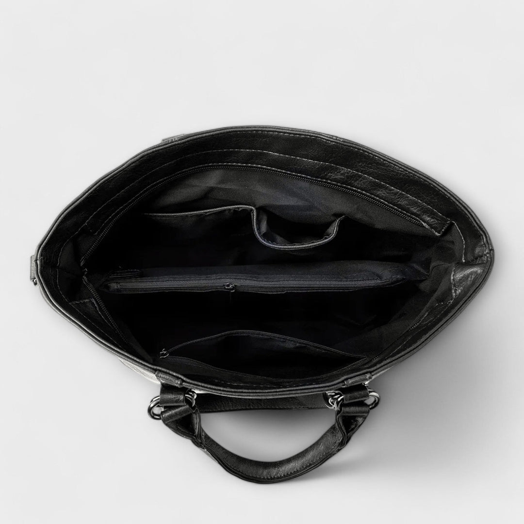 Dame trägt elegante Damen-Schultertasche, stilvolle Businesstasche für Business und Büroalltag.