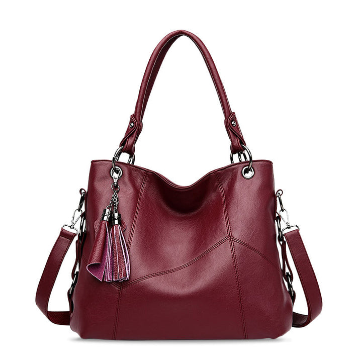 Elegante schwarze Damen Handtasche aus veganem Leder. Modische Umhängetasche, perfekt für Business und Freizeit.