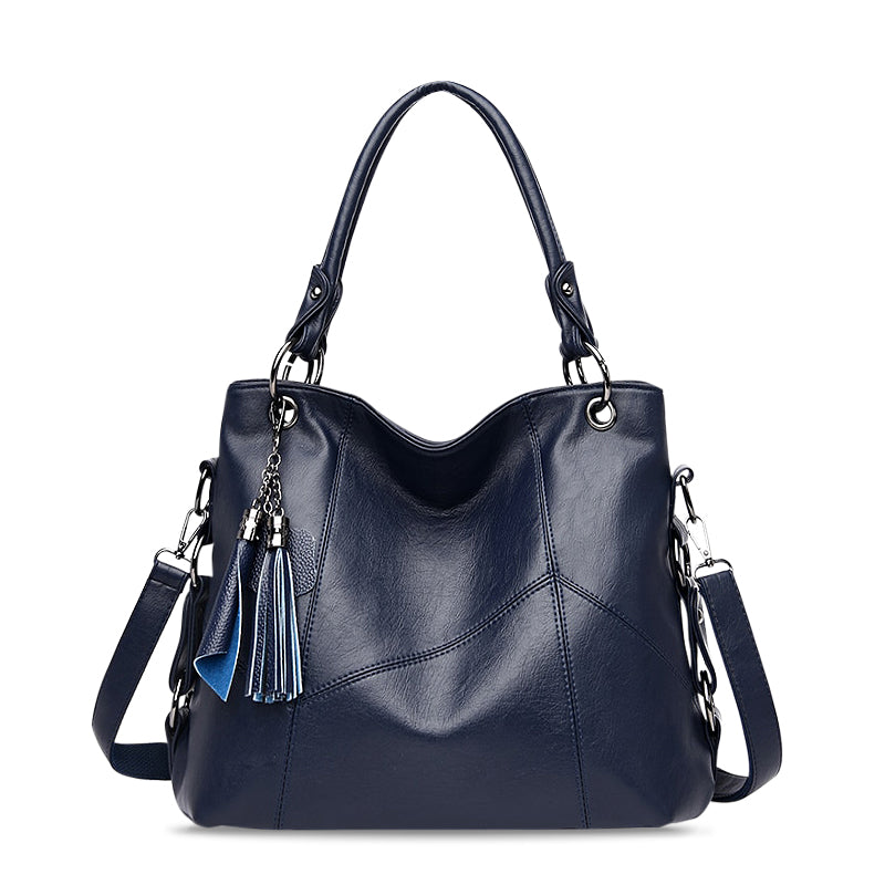 Vielseitige blaue Damen Handtasche aus veganem Leder. Praktische Umhängetasche, modisch und ideal für den Alltag.