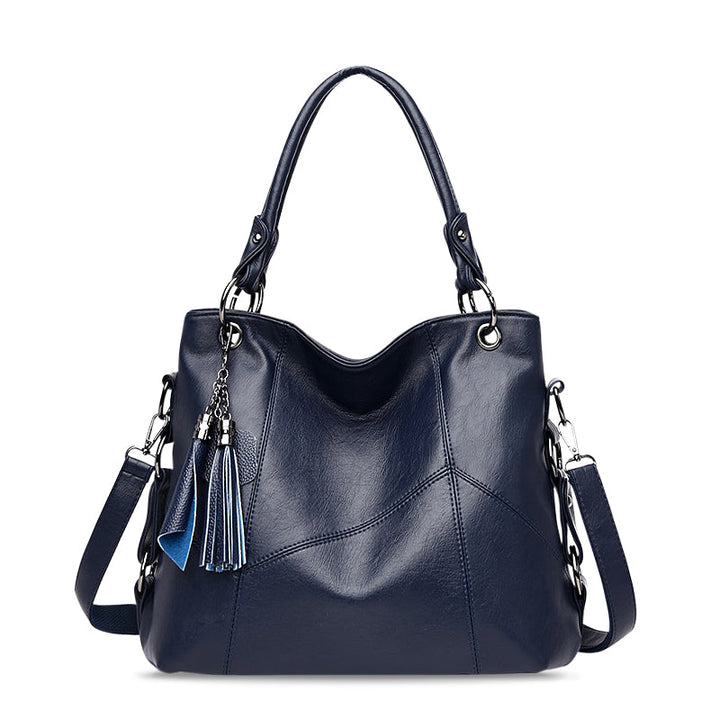 Vielseitige blaue Damen Handtasche aus veganem Leder. Praktische Umhängetasche, modisch und ideal für den Alltag.