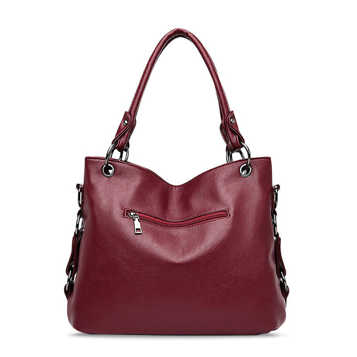 Stilvolle Damen Handtasche aus veganem Leder, als Umhängetasche tragbar. Vielseitiges Accessoire für jede Frau.