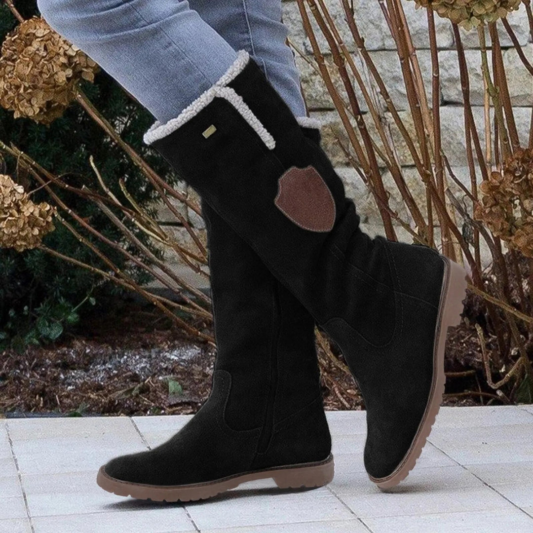 Bequeme und robuste knielange Damen-Winterstiefel, ideal für Alltag und Outdoor bei winterlicher Kälte.