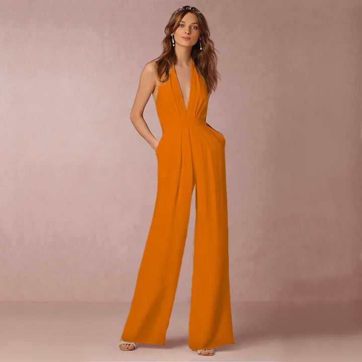 Schicker, ärmelloser Damen Overall für Cocktailpartys. Verfügt über einen V-Ausschnitt und fließendes weites Bein.