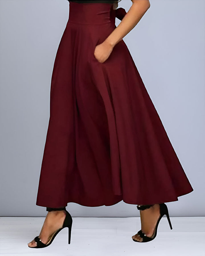Moderner Freizeit Damenrock in Rot, eleganter Midi Schnitt für stilvolle Herbst- und Winteroutfits.