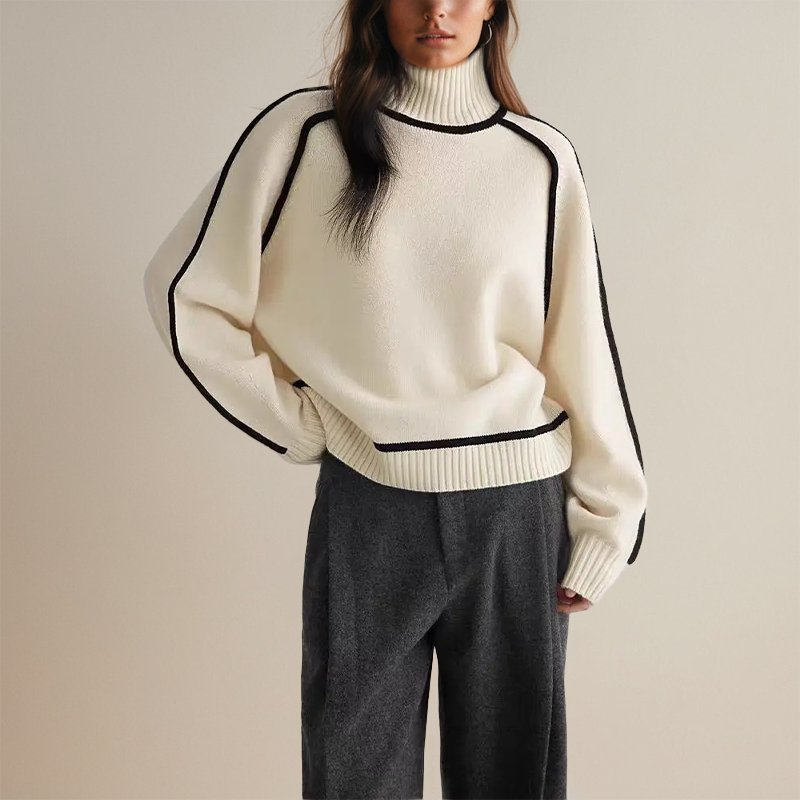 Detailaufnahme des eleganten Farbblock-Musters auf dem warmen Damen Winter Rollkragenpullover.