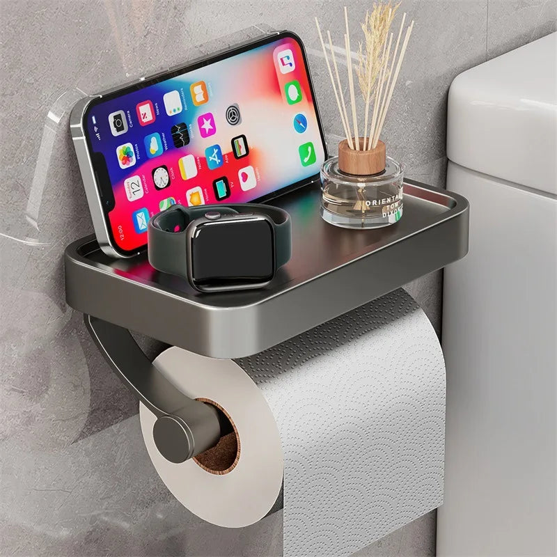 Detailansicht des Toilettenpapierhalters mit integrierter Ablage für Handy oder andere Gegenstände.