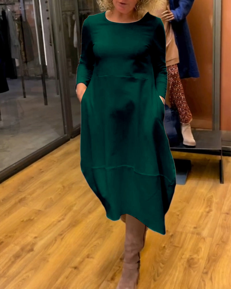 Elegantes Damen A-Linie Midikleid, langärmlig, mit Taschen, stilvoll kombiniert für festliche Anlässe.