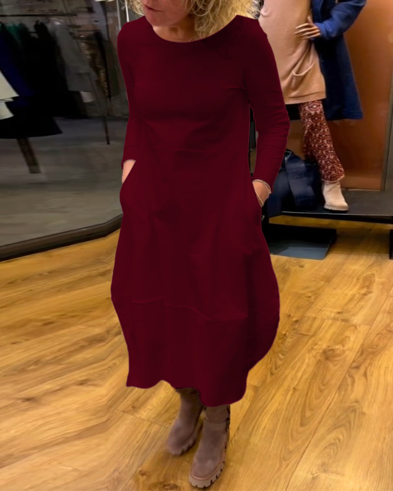 Gefaltetes Damen A-Linie Midikleid, langärmlig, mit elegantem Design und praktischen Taschen für Herbst/Winter.