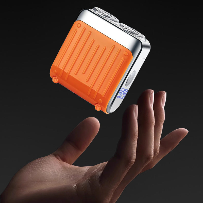 Elektrorasierer, grau-orange, kompakt, mit LED-Anzeige und magnetischer USB-C-Aufladung für nasse/trockene Rasuren.