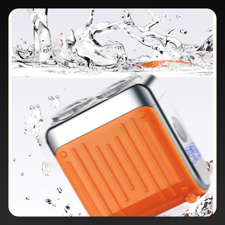 Elektrorasierer, grau-orange, kompakt, mit LED-Anzeige und magnetischer USB-C-Aufladung für nasse/trockene Rasuren.