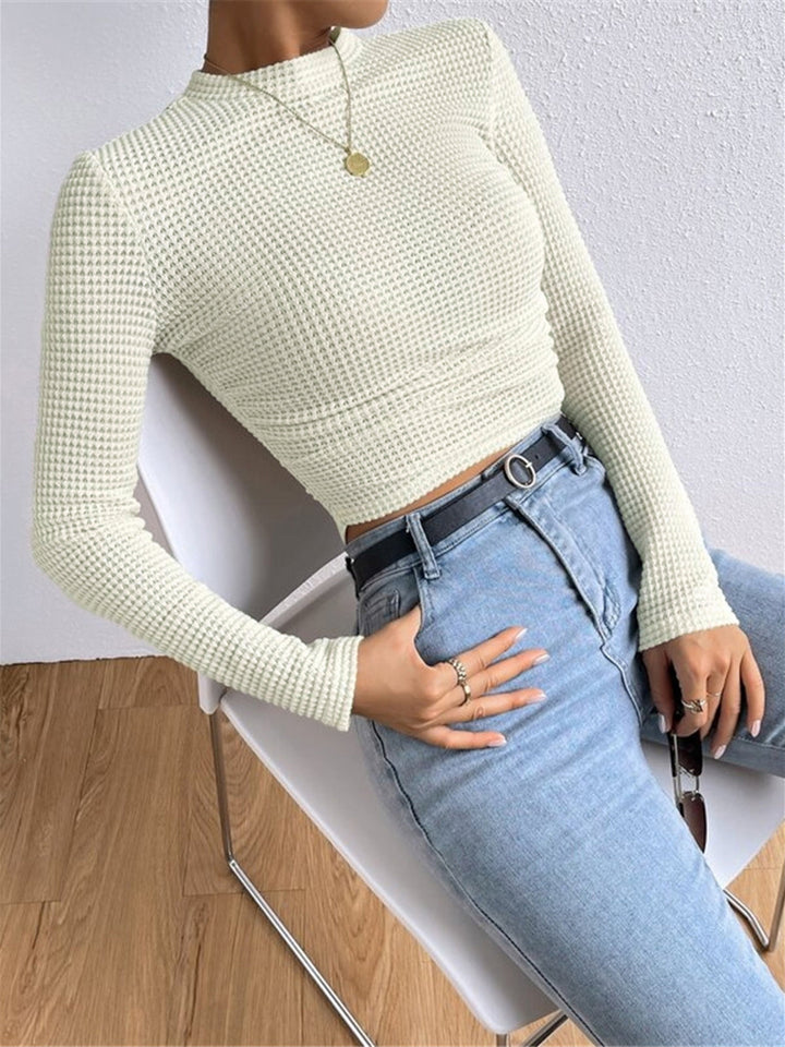 Elegantes Waffelstrick Langarmtop für Damen; enganliegend für frühlingshafte Tage und Damenmode.