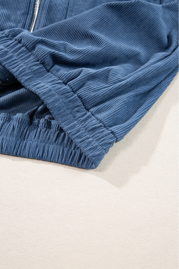Blaugrüne Cordjacke mit Kapuze und Kordelzug