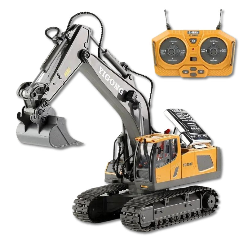 "Gelber RC Bagger mit realistischer Schaufel auf Sandboden, ideal für drinnen und draußen, robust und langlebig."