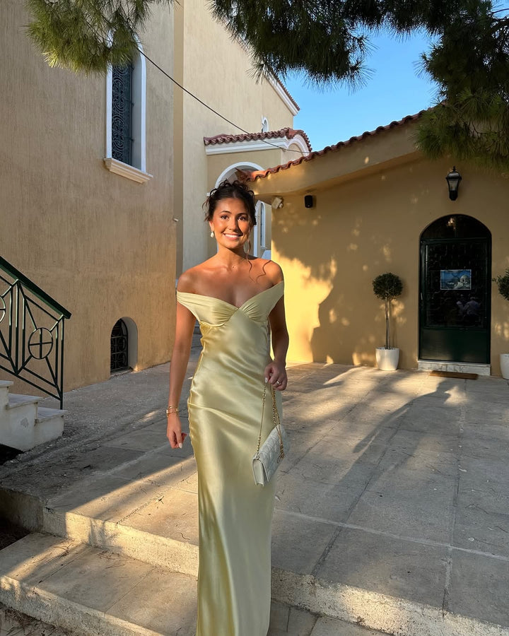 Elegantes gelbes Damen Maxikleid mit tiefem Rückenausschnitt, ideal als festliches Anlasskleid.