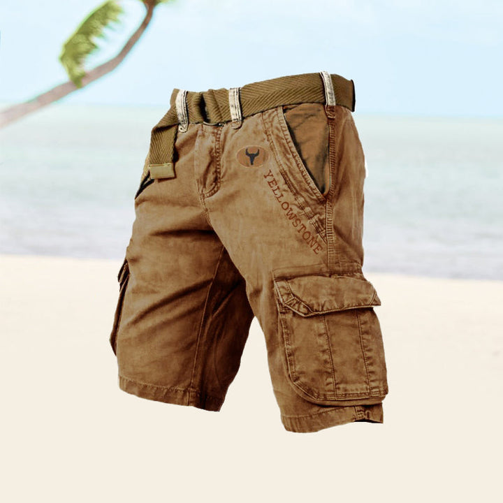 Graue Cargo-Shorts für Herren, seitliche Ansicht, langlebiges Baumwollmaterial, sechs Taschen, ideal für Sommeraktivitäten.