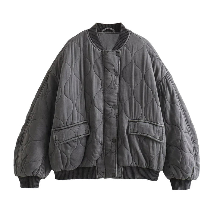 Locker geschnittene graue Damen Steppjacke. Trendy Übergangsjacke für vielseitige Frühlings- und Herbst-Outfits.
