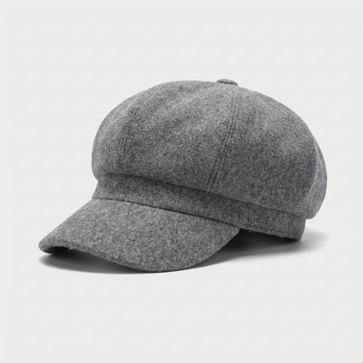 Graue Vintage Unisex Ballonmütze aus Baumwolle, warm und modisch für den Winter.