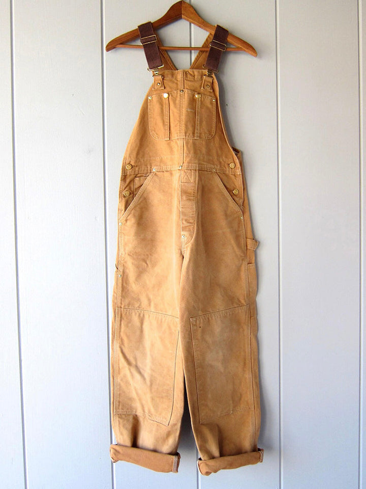 Herren Canvas Latzhose im Vintage-Stil, robuste Arbeitskleidung mit praktischen Taschen.