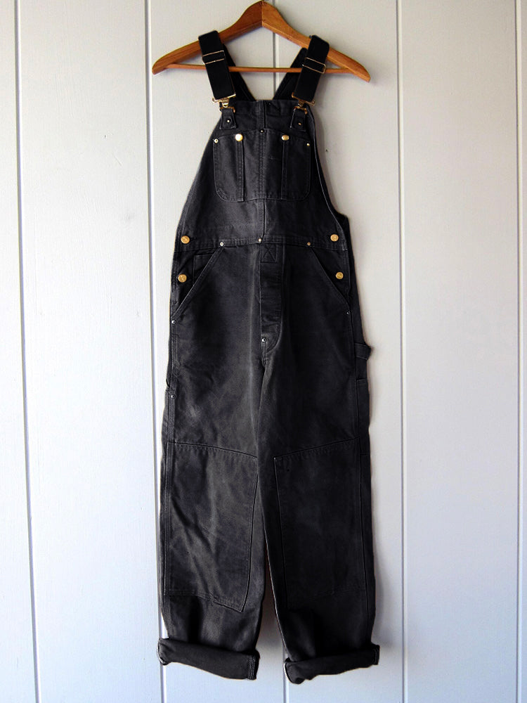 Stilvolle Herren Canvas Latzhose, Vintage-Look für modische urbane Freizeitmode und Outdoor-Aktivitäten.