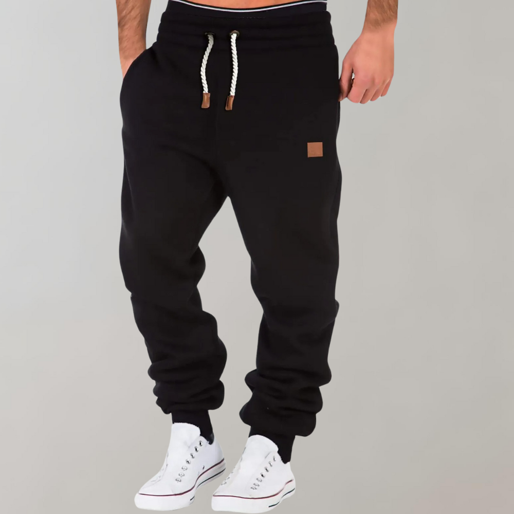 Herren Casual Jogginghose in Grau, stilvoll & bequem für Freizeit & Alltag, mit Kordelzug & tapered Bein.