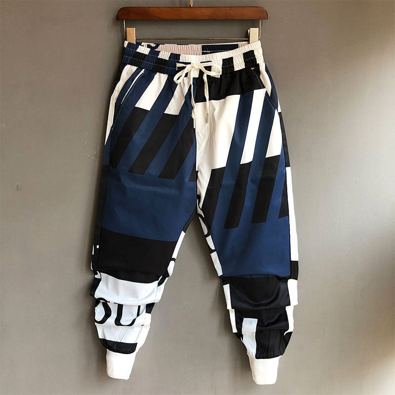 Herren Streetwear Jogginghose mit coolem Graffiti Print, Elastikbund & Bündchen für urbanen Style.