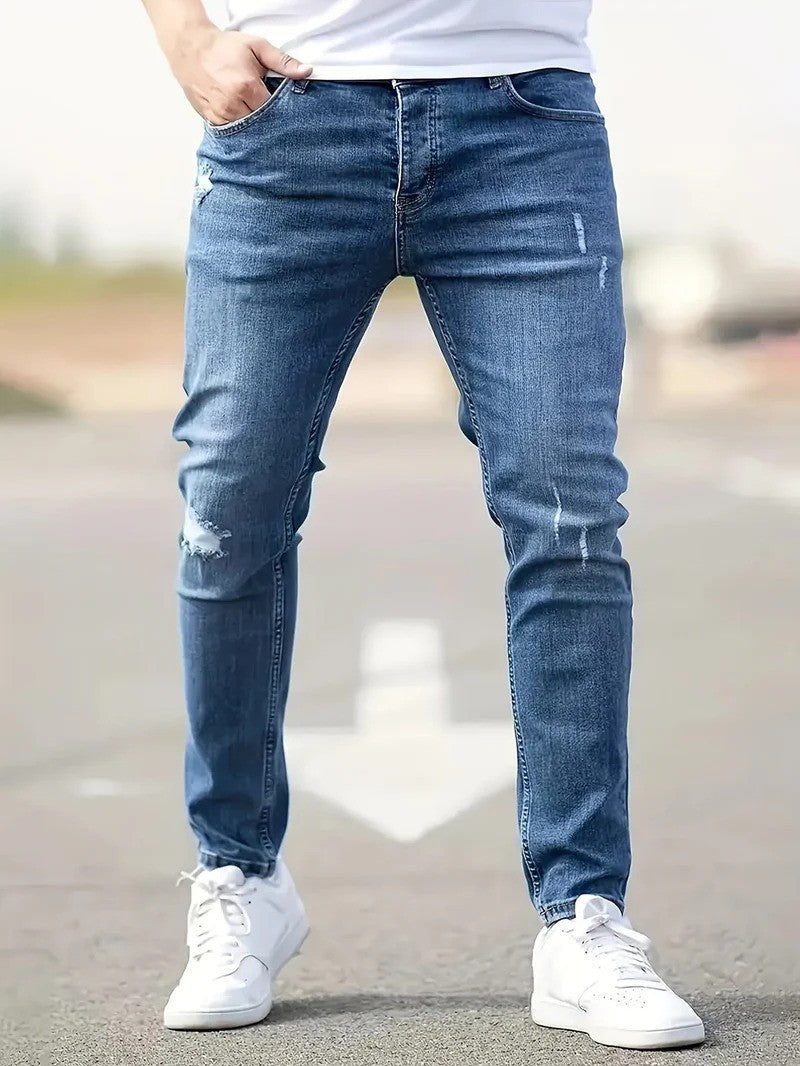 Herren-Stretch-Jeans im Ripped-Design, Slim Fit, in dunklem Denim für urbanen Freizeit-Look, komfortabel.