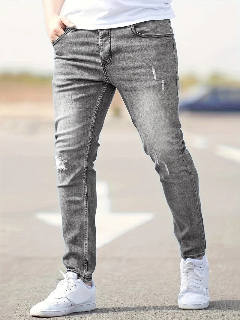 Stylische Herren-Jeans mit Stretch und zerrissenen Details, Slim Fit, bietet Bewegungsfreiheit für Streetwear.