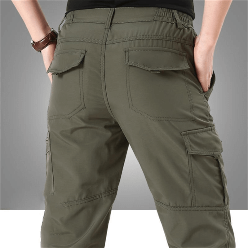 Robuste Herren Freizeithose, wasserdicht, taktisch, bequem, für Reisen, Abenteuer & den Alltag geeignet.