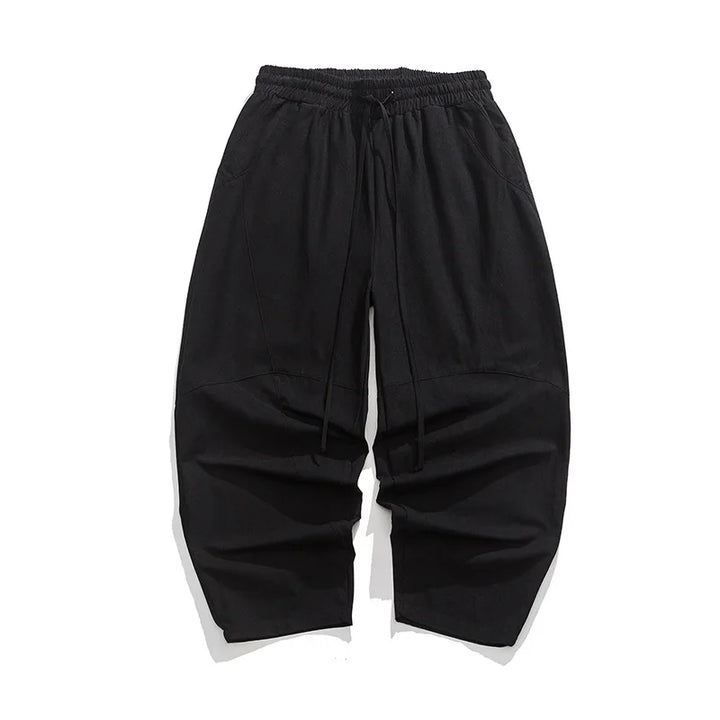 Elegante Herren-Weithose in Grau mit lockerem Schnitt, Elastikbund und stilvollen Ziernähten. Perfekt als Freizeithose.
