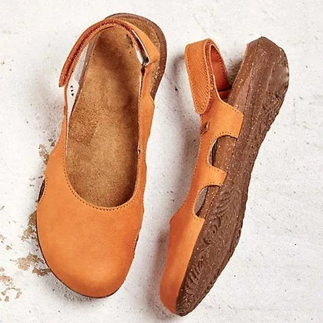 Orangene orthopädische Damen-Sandalen von oben und der Seite