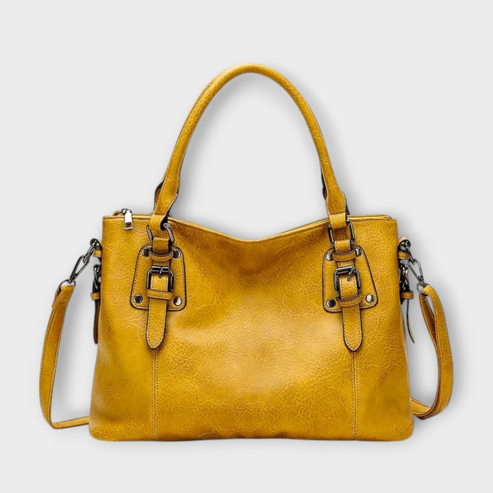 Damen Handtasche im klassischen Stil, erhältlich in Braun, Schwarz und Gelb. Vielseitiges Modeaccessoire.