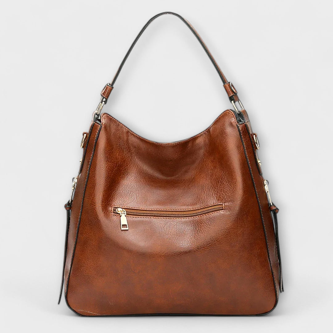 Modische Damen-Schultertasche in Schwarz, glattes Material, als vielseitige Alltagstasche tragbar.