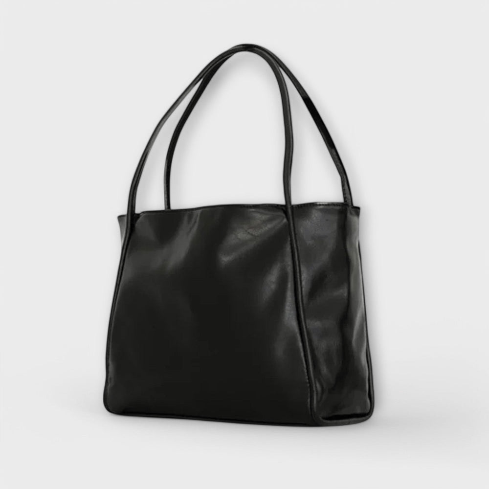 Dunkelbraune klassische Damen-Handtasche, vielseitiges Accessoire für mühelose Eleganz im Alltag.
