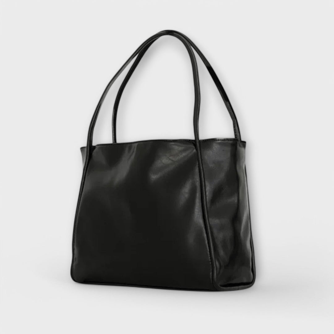 Dunkelbraune klassische Damen-Handtasche, vielseitiges Accessoire für mühelose Eleganz im Alltag.