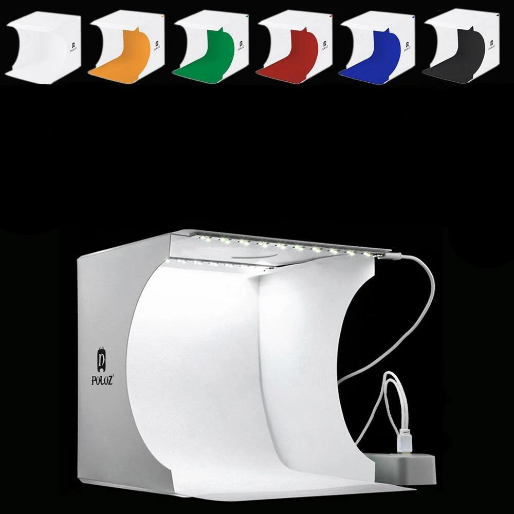 "Kompaktes tragbares Fotostudio mit LED-Licht: Weiße Box, darin hell beleuchtet, ideal für Produktfotografie Gadgets."