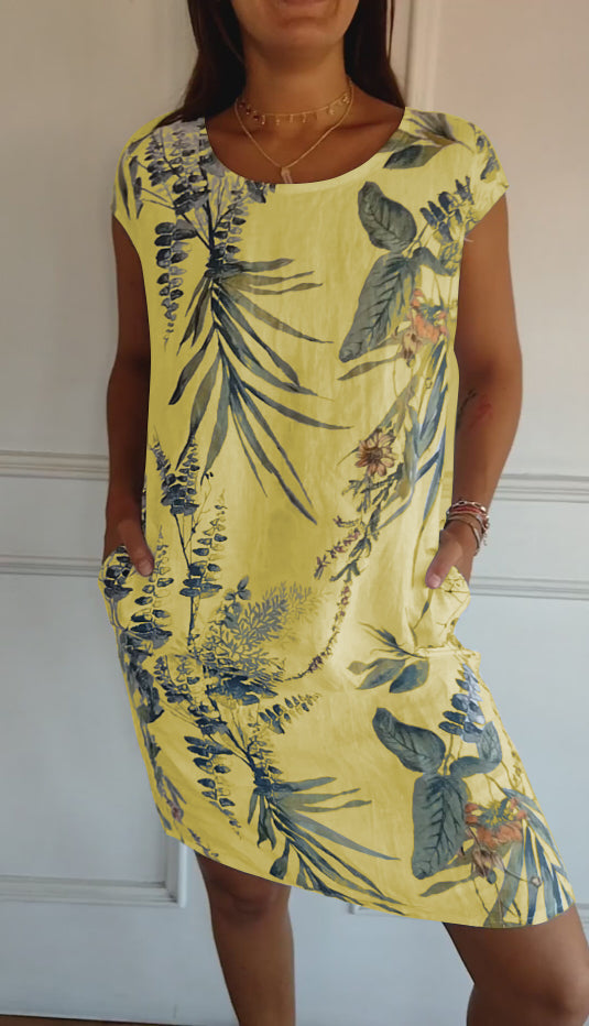 Stylisches Damen Sommerkleid mit lebhaftem Blattmuster. Lässig, bequem und luftig für heiße Sommertage & Urlaub.