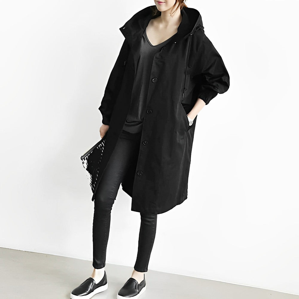 Wasserdichte, sportliche Unisex Regenjacke mit Kapuze, lang geschnitten für Outdoor & Freizeit.